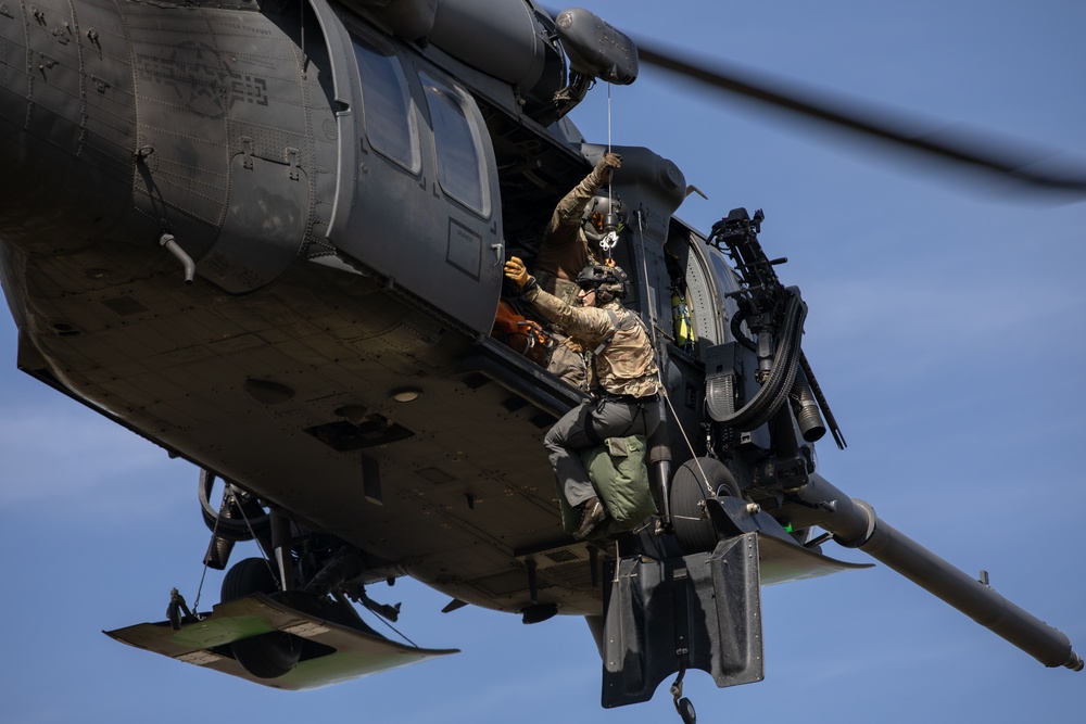 Alaska Air National Guardsmen showcase rescue demonstration during multi-agency hoist symposium