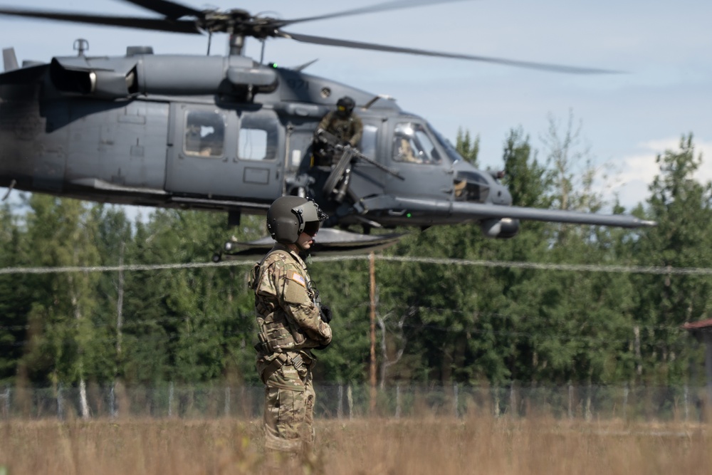 Alaska Air National Guardsmen showcase rescue demonstration during multi-agency hoist symposium