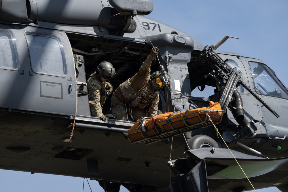 Alaska Air National Guardsmen showcase rescue demonstration during multi-agency hoist symposium
