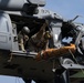 Alaska Air National Guardsmen showcase rescue demonstration during multi-agency hoist symposium