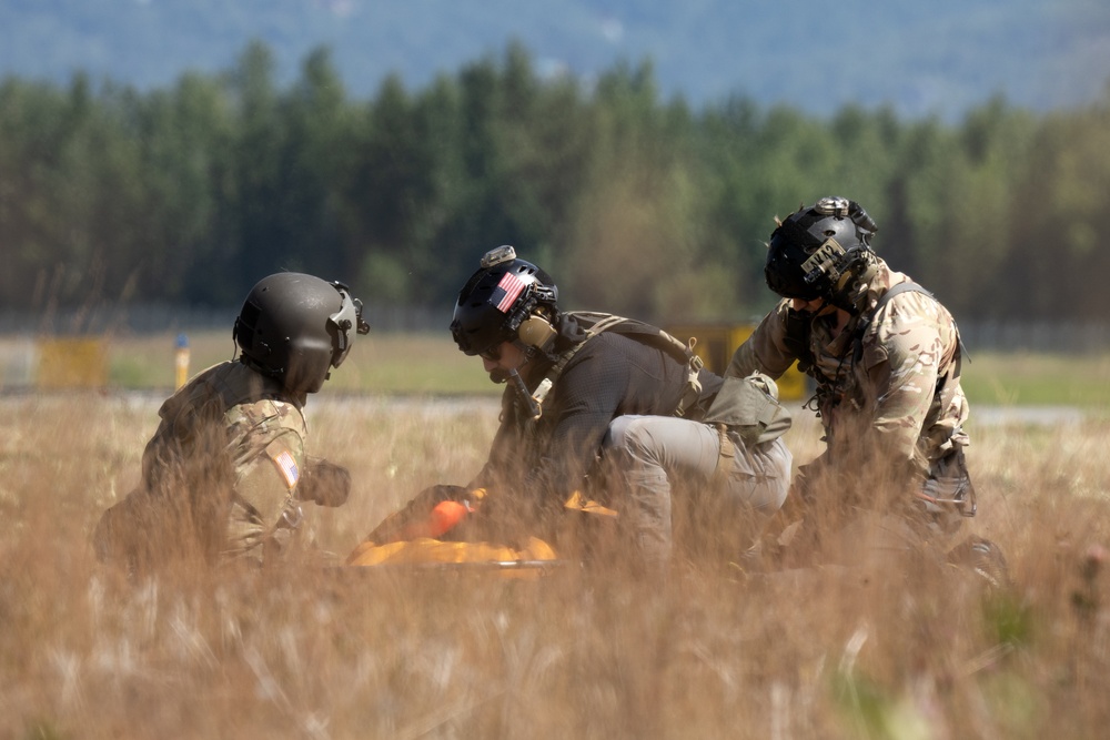 Alaska Air National Guardsmen showcase rescue demonstration during multi-agency hoist symposium