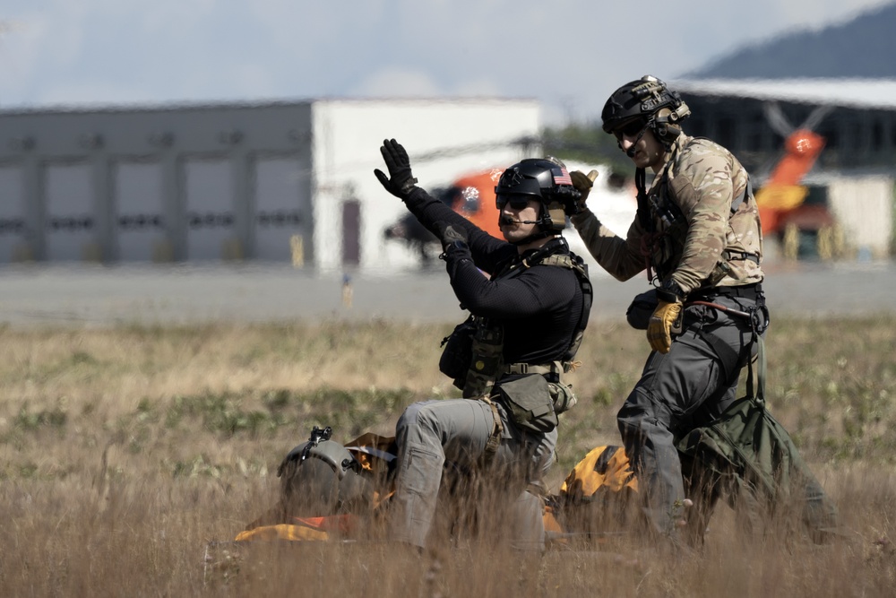 Alaska Air National Guardsmen showcase rescue demonstration during multi-agency hoist symposium