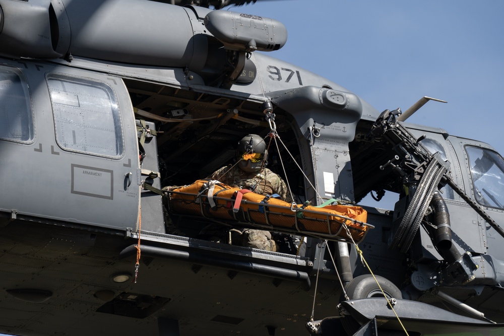 Alaska Air National Guardsmen showcase rescue demonstration during multi-agency hoist symposium