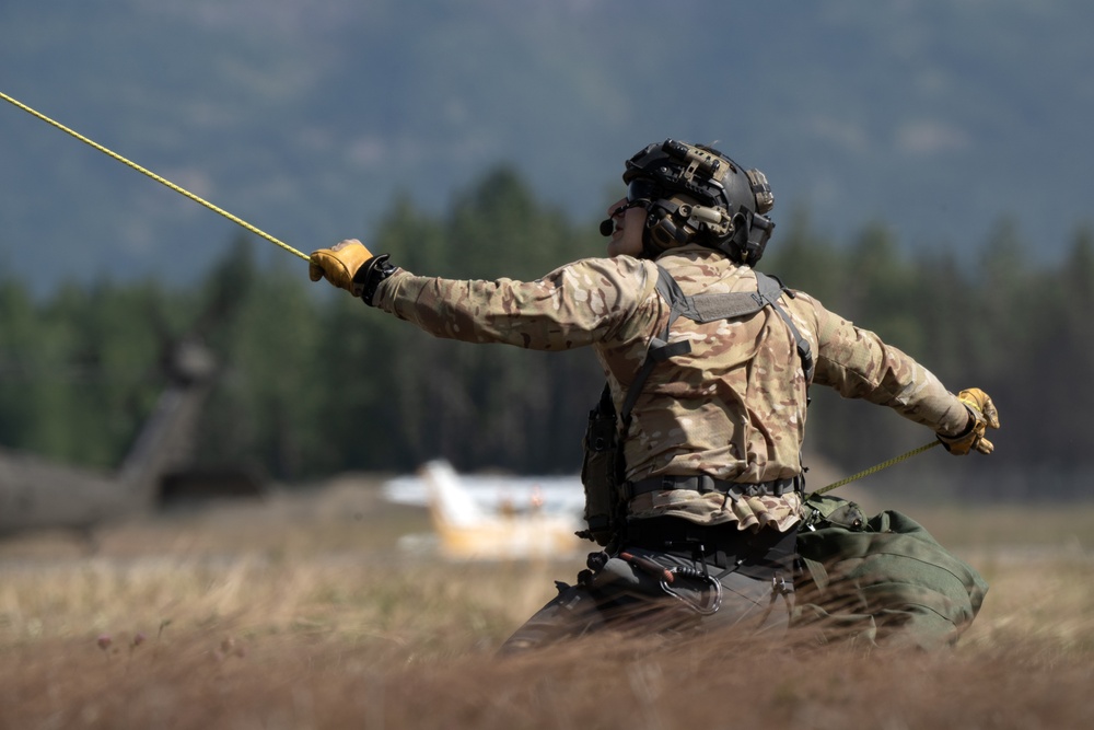 Alaska Air National Guardsmen showcase rescue demonstration during multi-agency hoist symposium