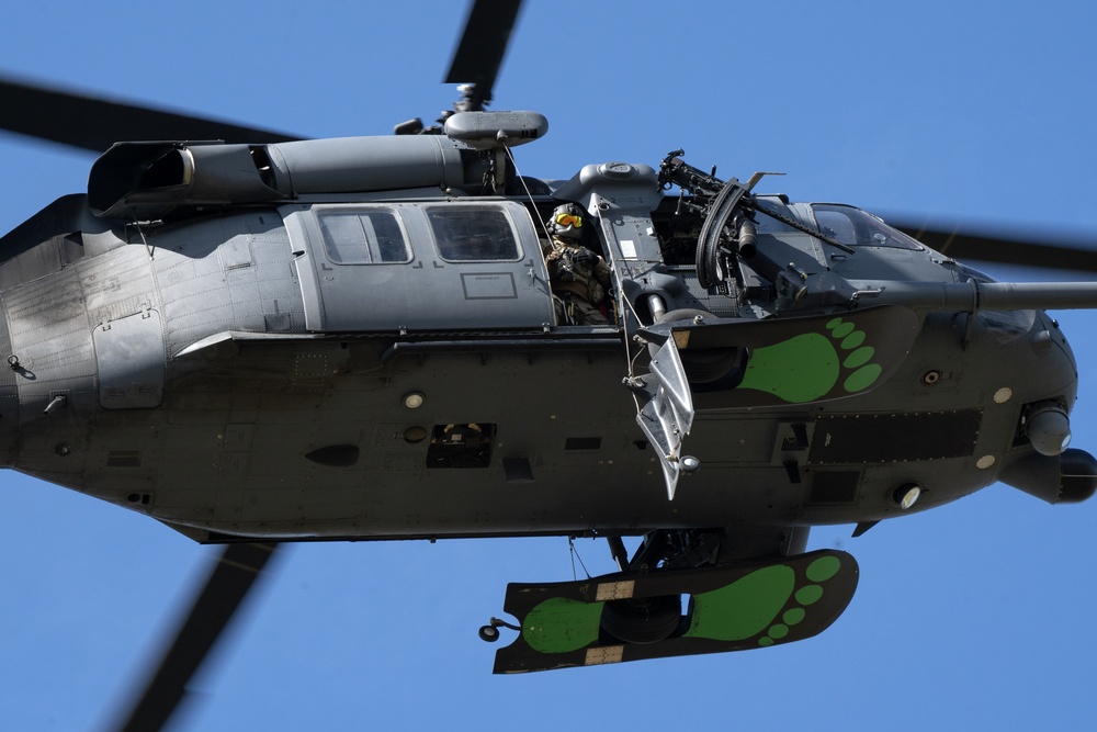 Alaska Air National Guardsmen showcase rescue demonstration during multi-agency hoist symposium