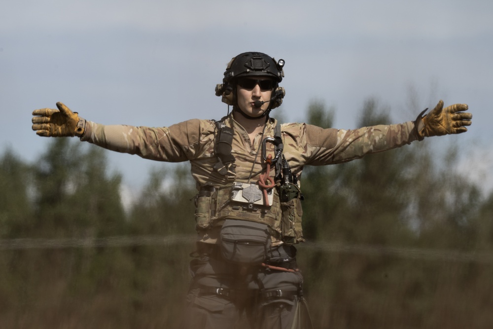 Alaska Air National Guardsmen showcase rescue demonstration during multi-agency hoist symposium