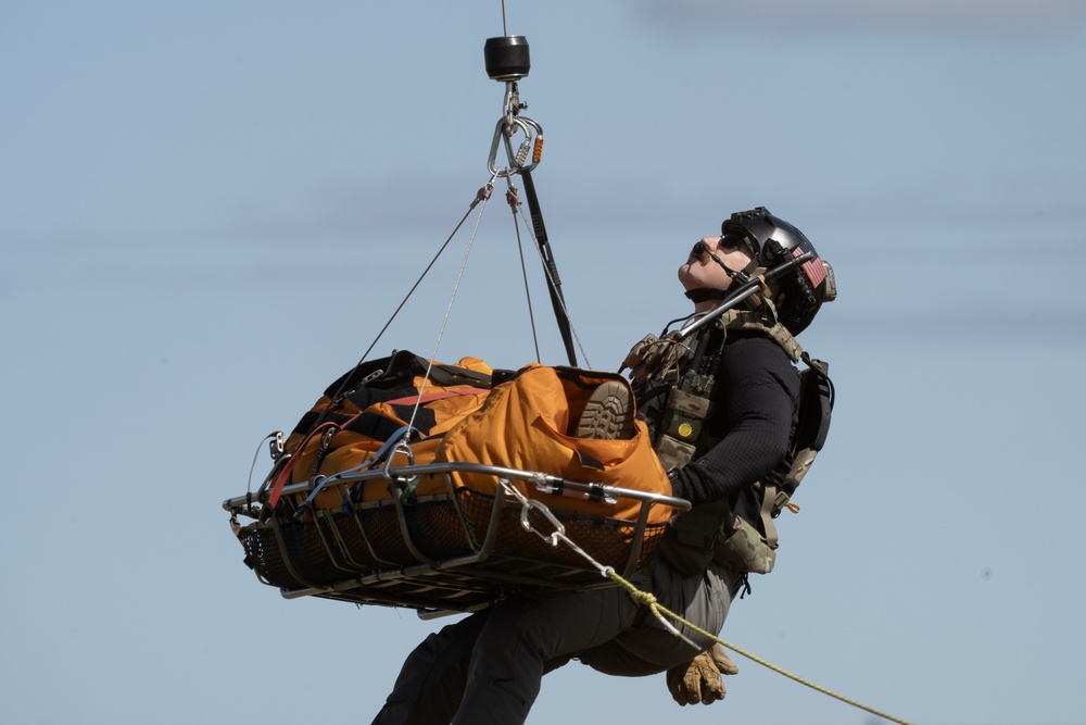 Alaska Air National Guardsmen showcase rescue demonstration during multi-agency hoist symposium