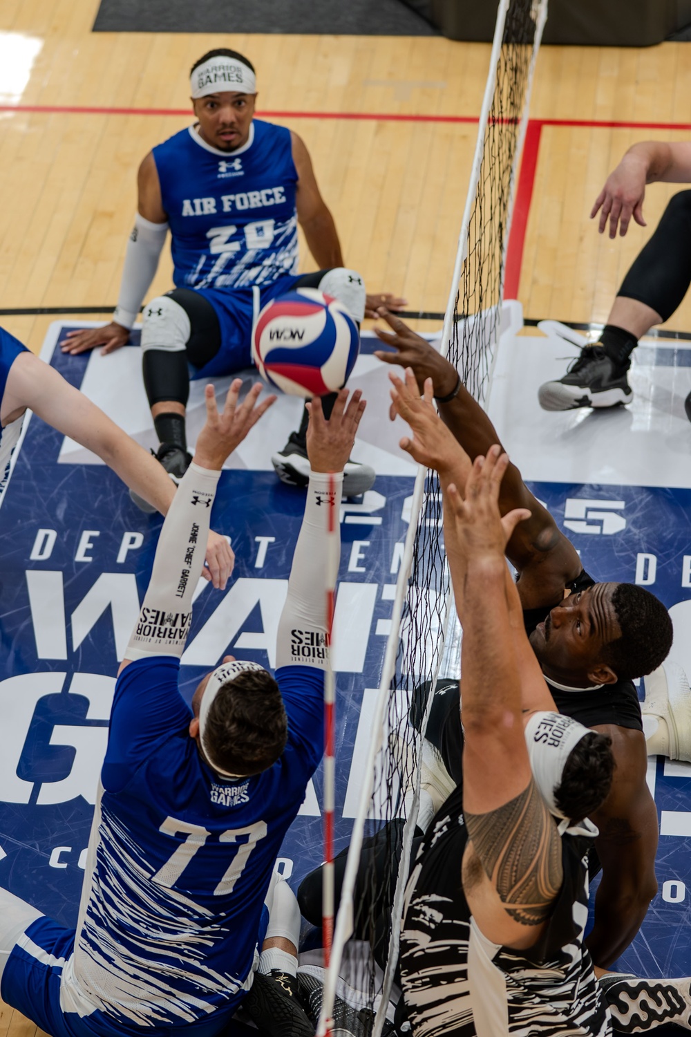 Air Force Warrior Games Athletes compete in sitting volleyball