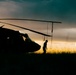 Washington National Guard Black Hawk helicopters at sunset