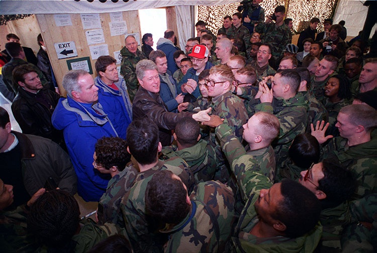 U.S. Army soldiers shake hands with President Bill Clinton in Hungary.