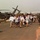 Evacuees from Liberia are led away from a U.S. Air Force MH-53 Pavelow.