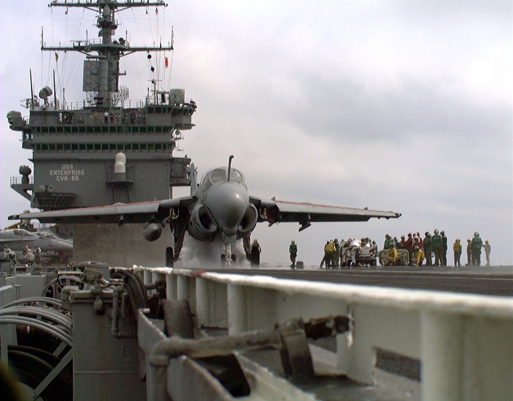 An A-6 Intruder is readied for launch during flight ops on the USS Enterprise.