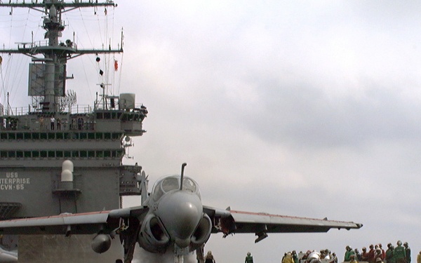 An A-6 Intruder is readied for launch during flight ops on the USS Enterprise.