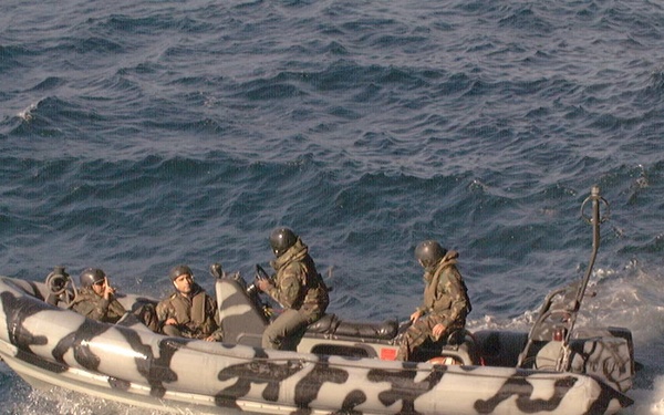 U.S. Navy SEAL's deploy from the USS Chinook in Zodiac RIB boats.