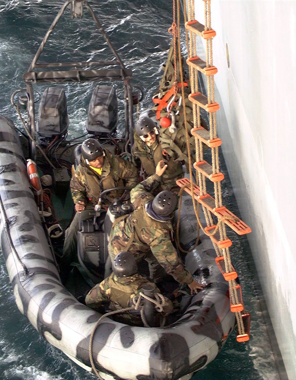 U.S. Navy SEAL's from rehearse ship-to-ship boarding procedures.