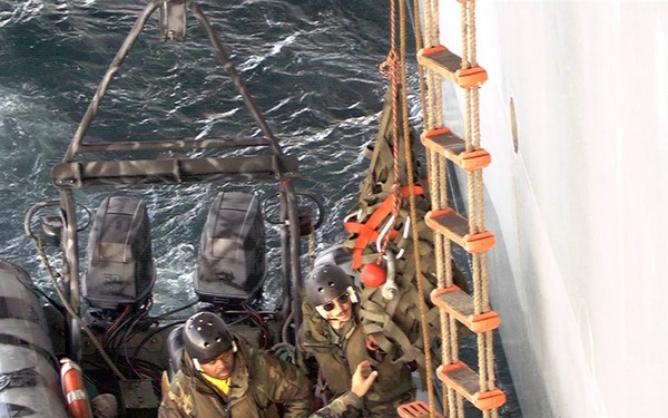 U.S. Navy SEAL's from rehearse ship-to-ship boarding procedures.