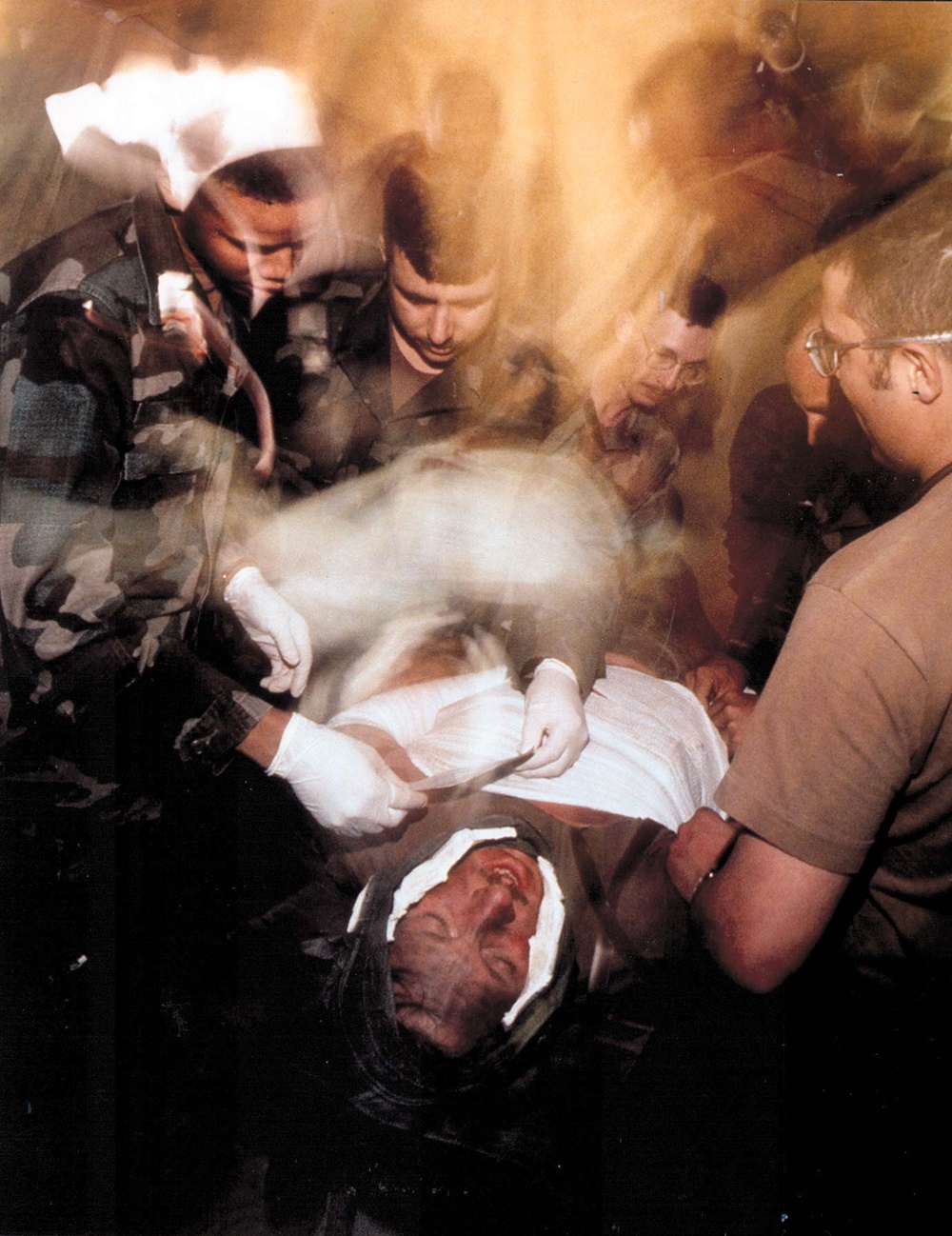 Second Place Combat Camera:  'Field Hospital Emergency' by Staff Sgt. Lance Cheung, U.S. Air Force.