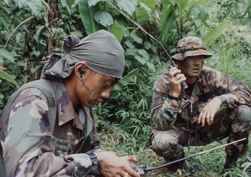 Royal Thai and U.S. Air Force communicate on a PRC-90 HF Radio.