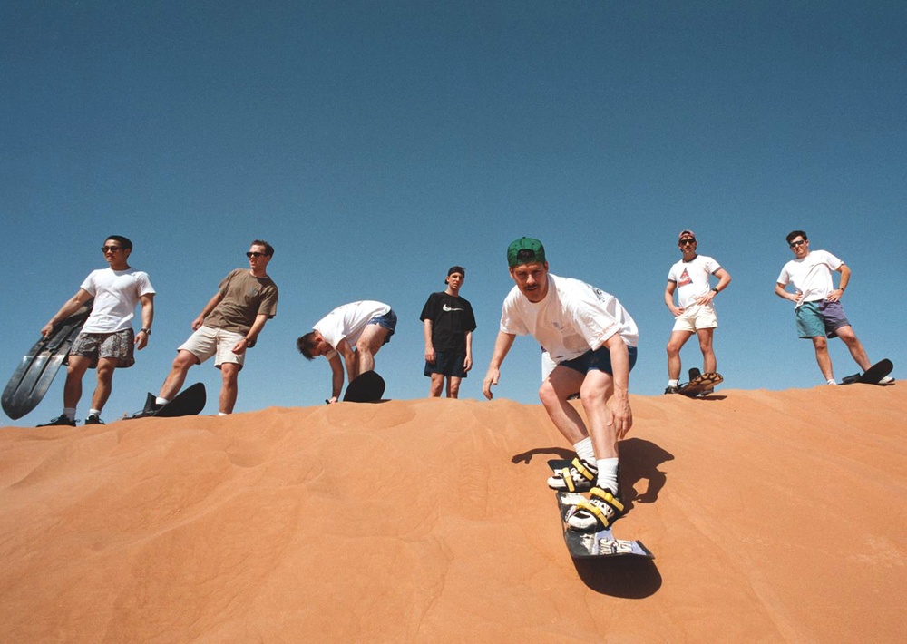 Sailors hit the slopes of the desert dunes outside Jebel Ali, United Arab Emirates.