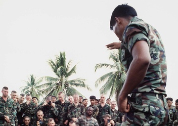 Royal Thai Army instructor uses a cobra to demonstrate jungle survival skills.