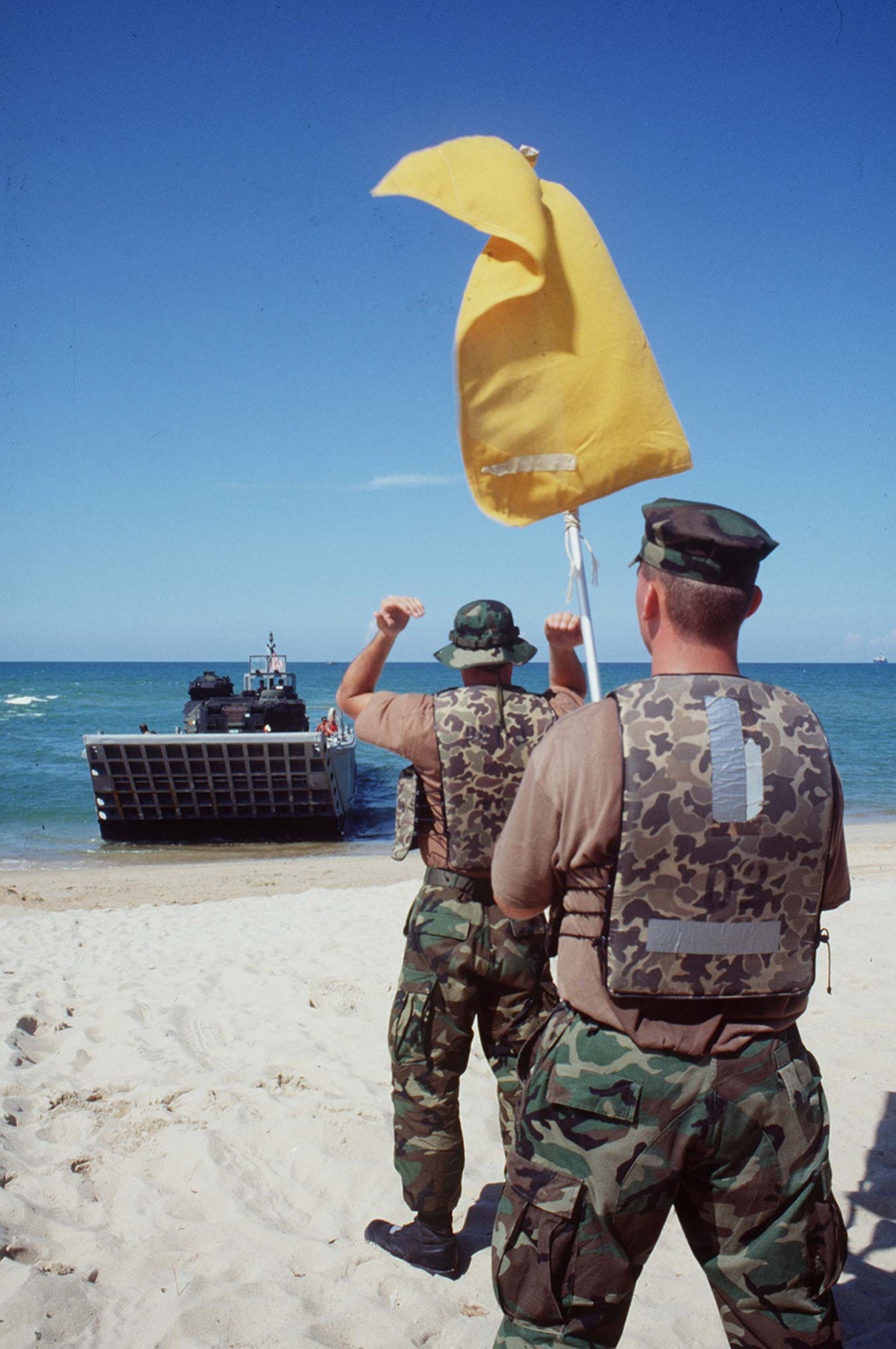U.S. Navy Beach Masters direct a landing craft at Narathiwat, Thailand.