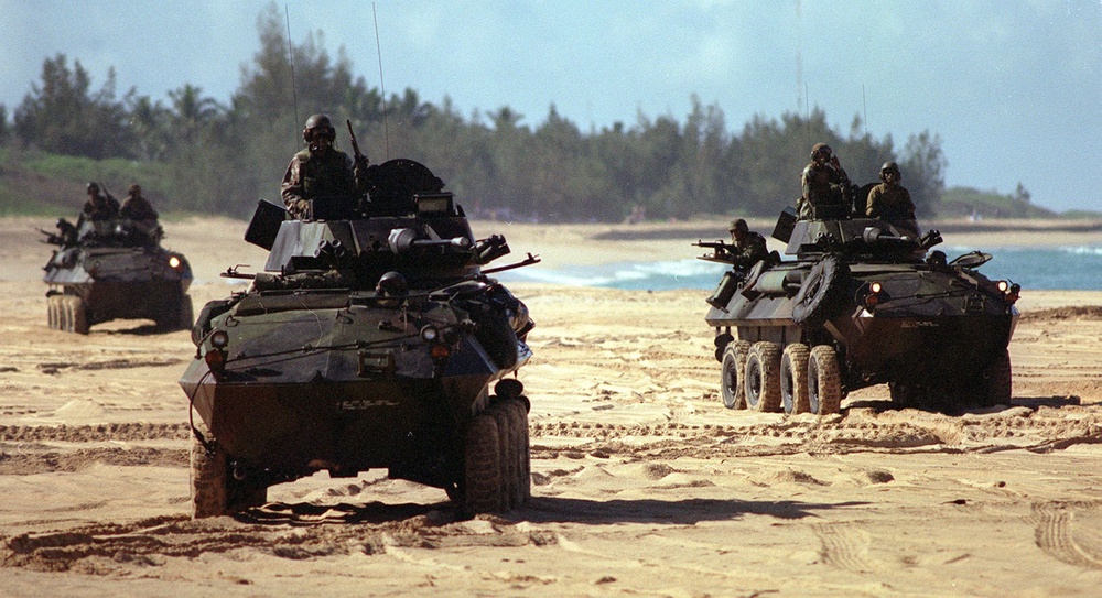 Marine LAV's maneuver on the beach during RIMPAC '96.