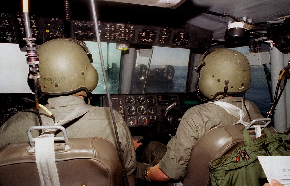Navy enlisted crew pilots a Landing Craft Air Cushion