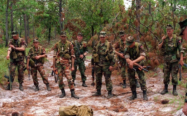 Baltic soldier practices recovering personnel from a mine field.