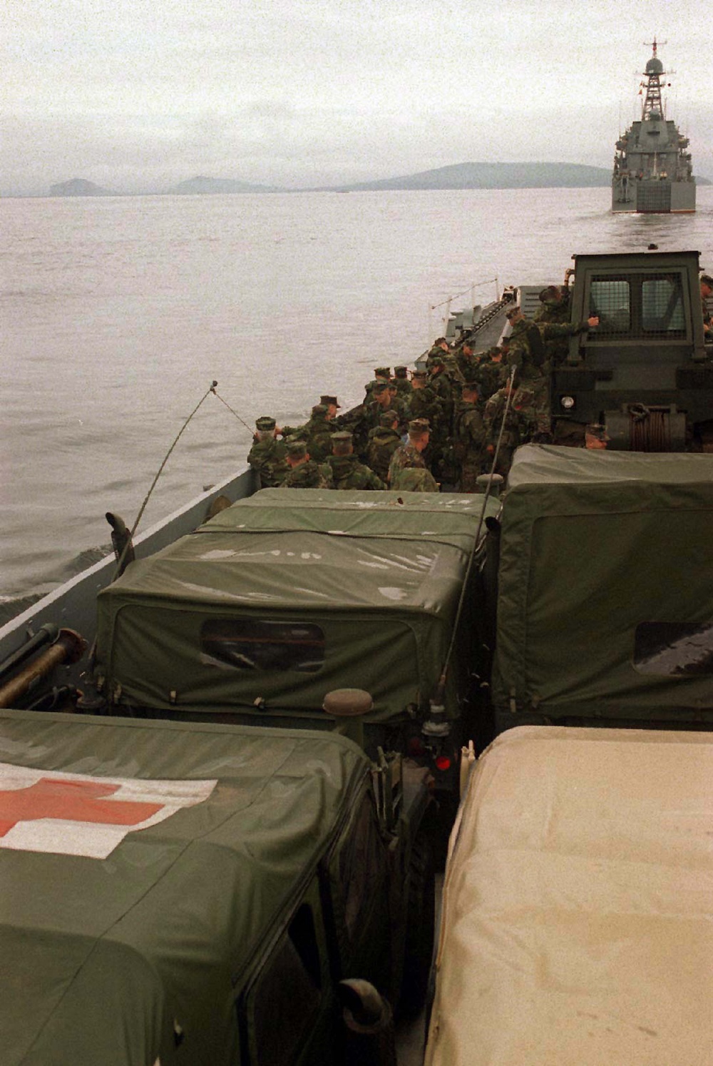 U.S. Navy landing craft follows a Russian Ropuchhka II amphibious assault ship.