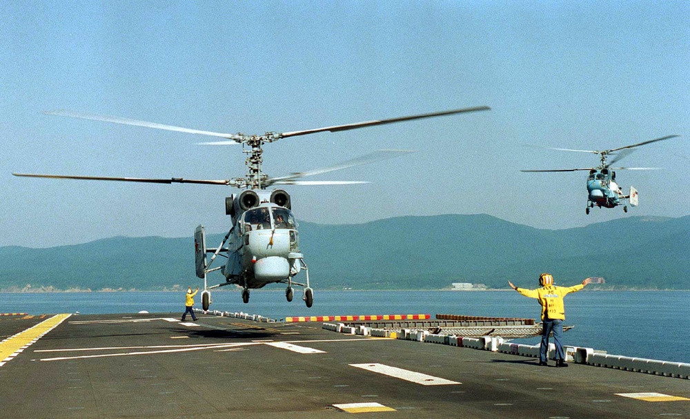Russian Helix helicopters prepare to land on the USS Belleau Wood.