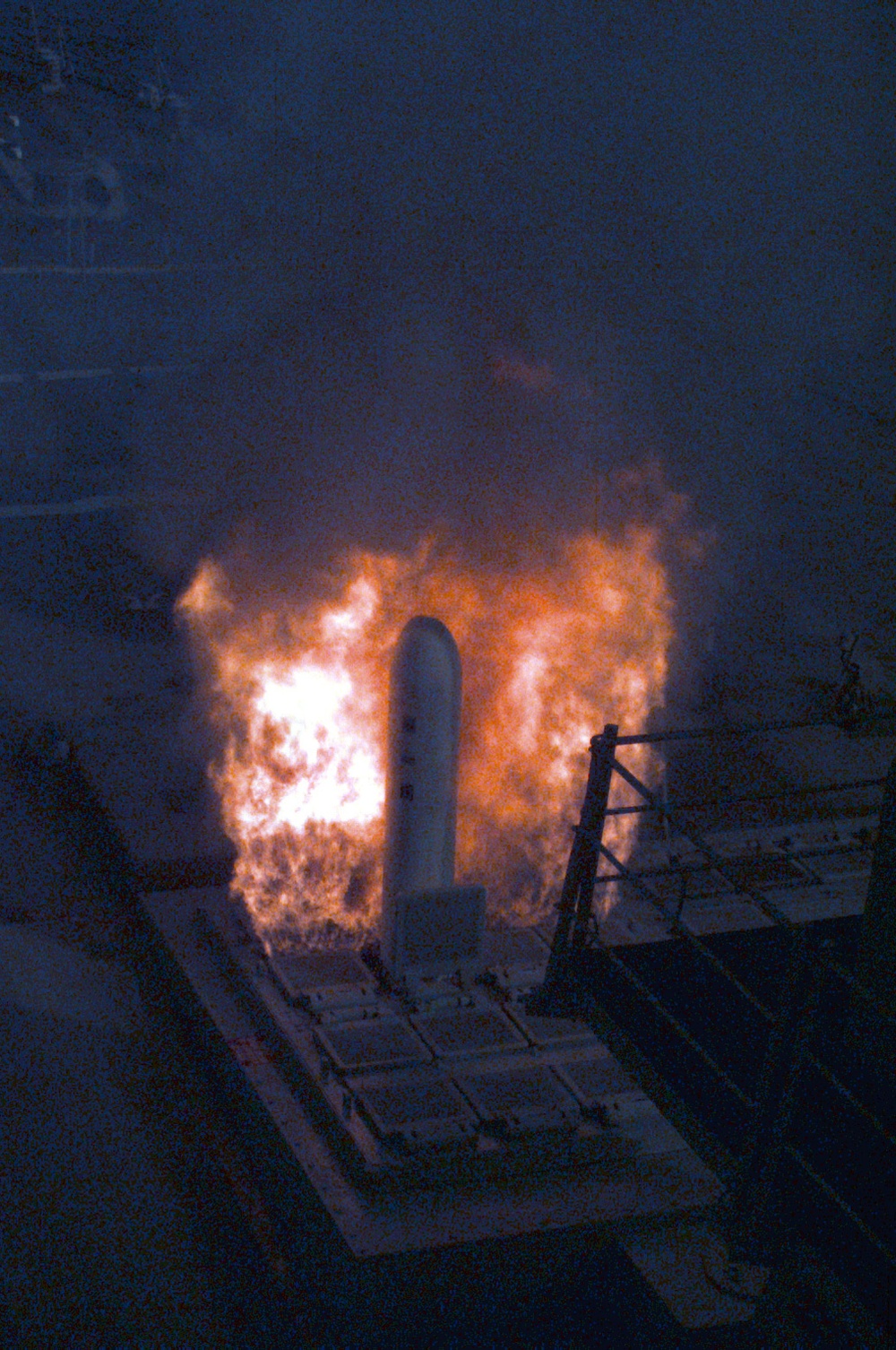 A Tomahawk emerges from the vertical launcher in the bow of the USS Laboon.