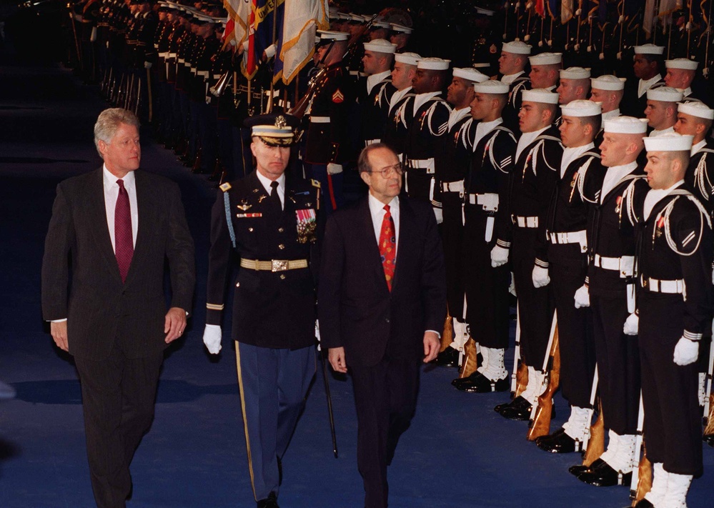 President Clinton and Secretary of Defense Perry inspect the troops at Fort Myer, Va.