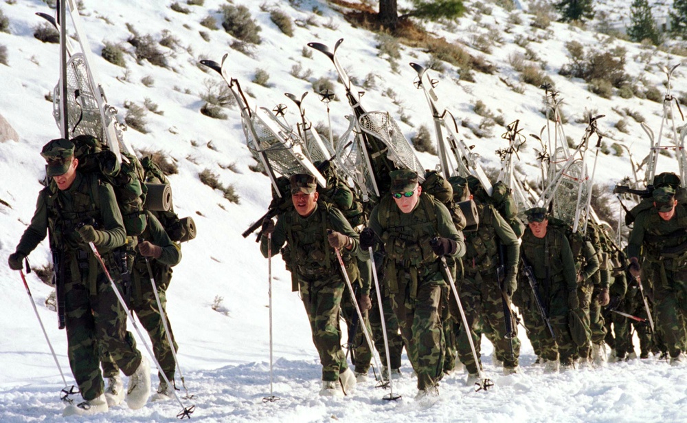 Marines march in for training in tactical operations in the arctic environment.