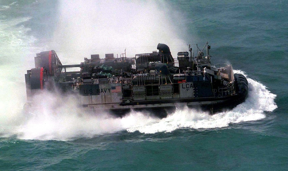 U.S. Navy Landing Craft Air Cushion hustles to Freshwater Beach.
