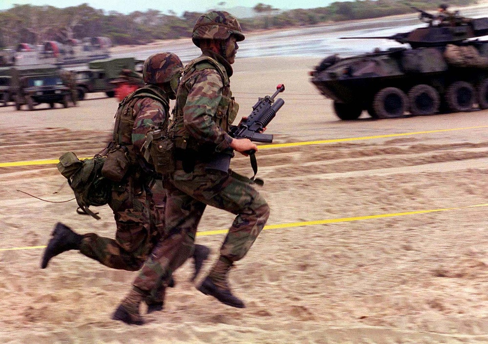 U.S. Marines race down the beach at Freshwater Beach, Rockhampton, Australia.