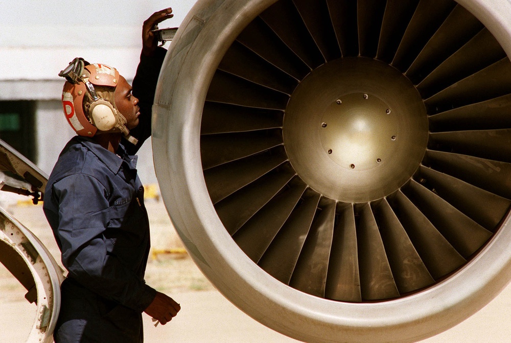 Navy Airman Otis Miller performs pre-checks on a S-3 Viking.