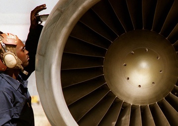 Navy Airman Otis Miller performs pre-checks on a S-3 Viking.