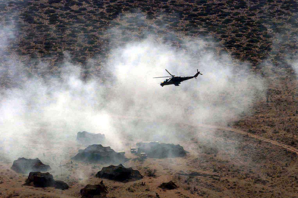 MI-24 Hind attack helicopter simulates ground attacks on an air defense site.