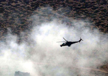 MI-24 Hind attack helicopter simulates ground attacks on an air defense site.