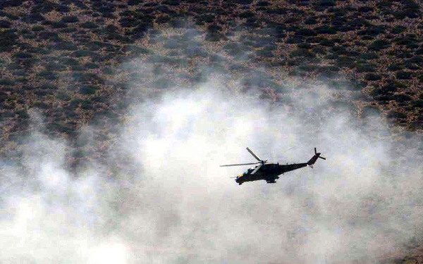MI-24 Hind attack helicopter simulates ground attacks on an air defense site.