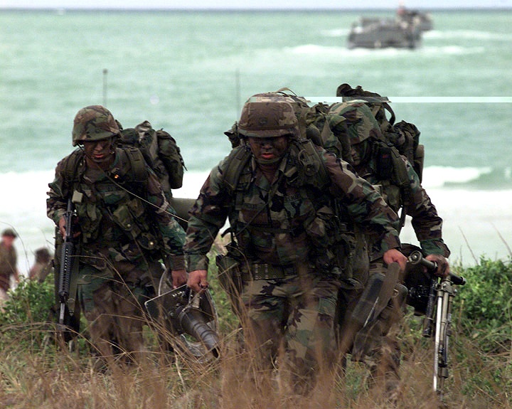 U.S. Marines hustle as they assault Red Beach as part of Exercise Cobra Gold '97.