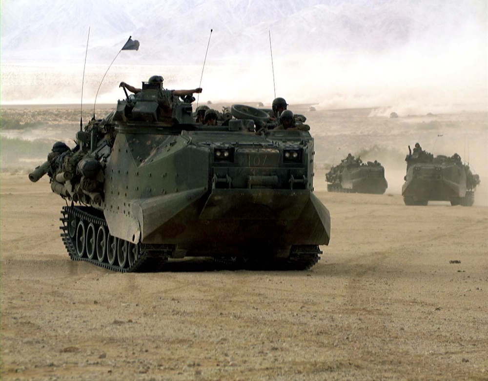 AAV's create waves of dust at the Marine Corps Air Ground Combat Center.