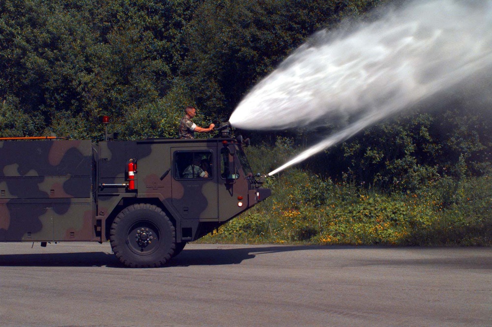 Gunnery Sgt. Cooper prepares a fire truck for shipment to Estonia for Baltic Challenge 97.