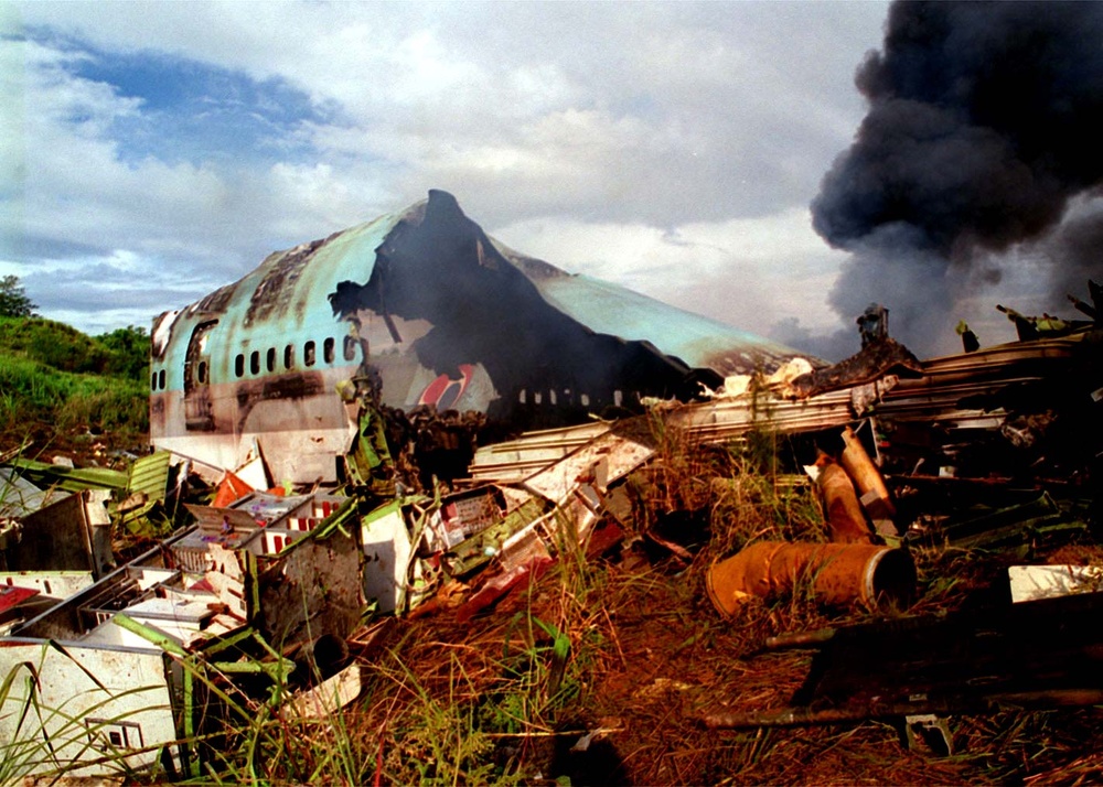 The wreckage of Korean Airlines flight 801 burns.