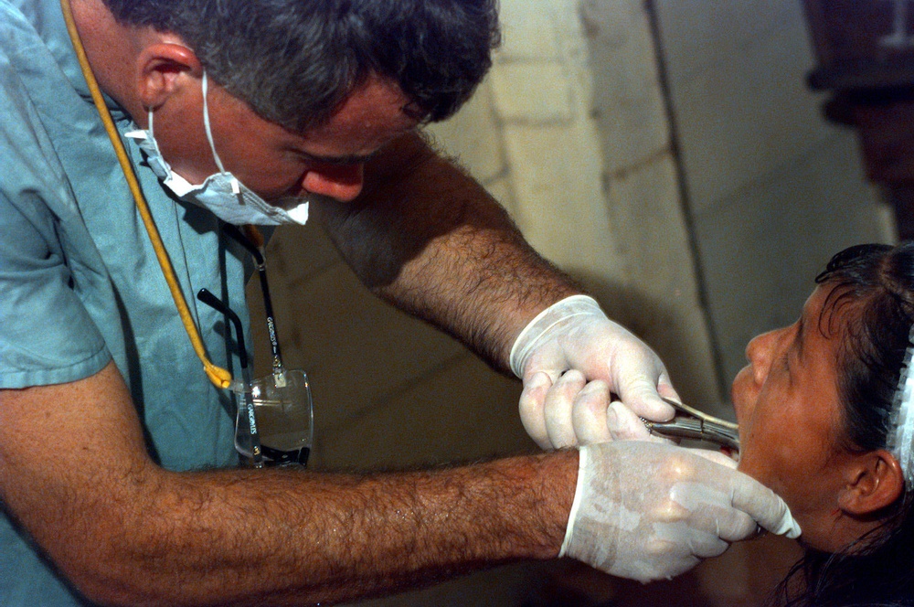 Maj. Michael Child extracts the wisdom teeth of a young girl in Guyana.