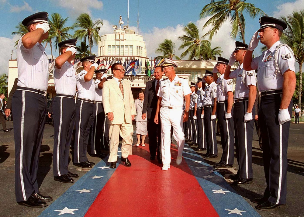 Adm. Prueher escorts Chinese President Jiang through an Air Force Honor Guard.