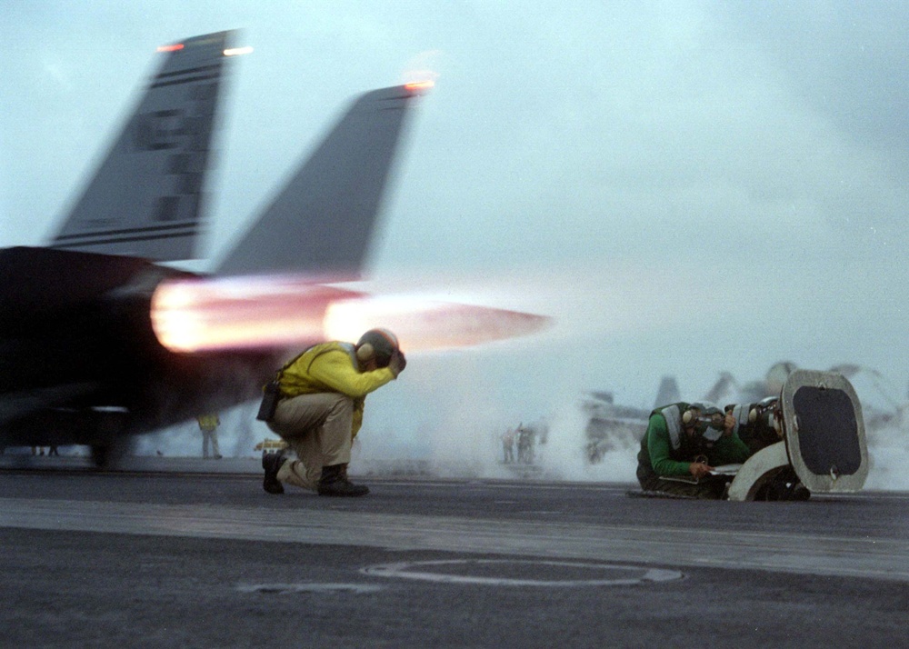 F-14 Tomcat launches from the aircraft carrier USS Nimitz in the Persian Gulf.