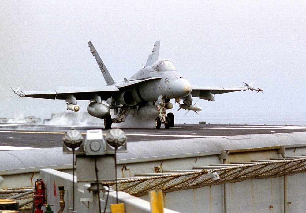 F/A-18C Hornet launches from the waist catapult of the aircraft carrier USS Nimitz.