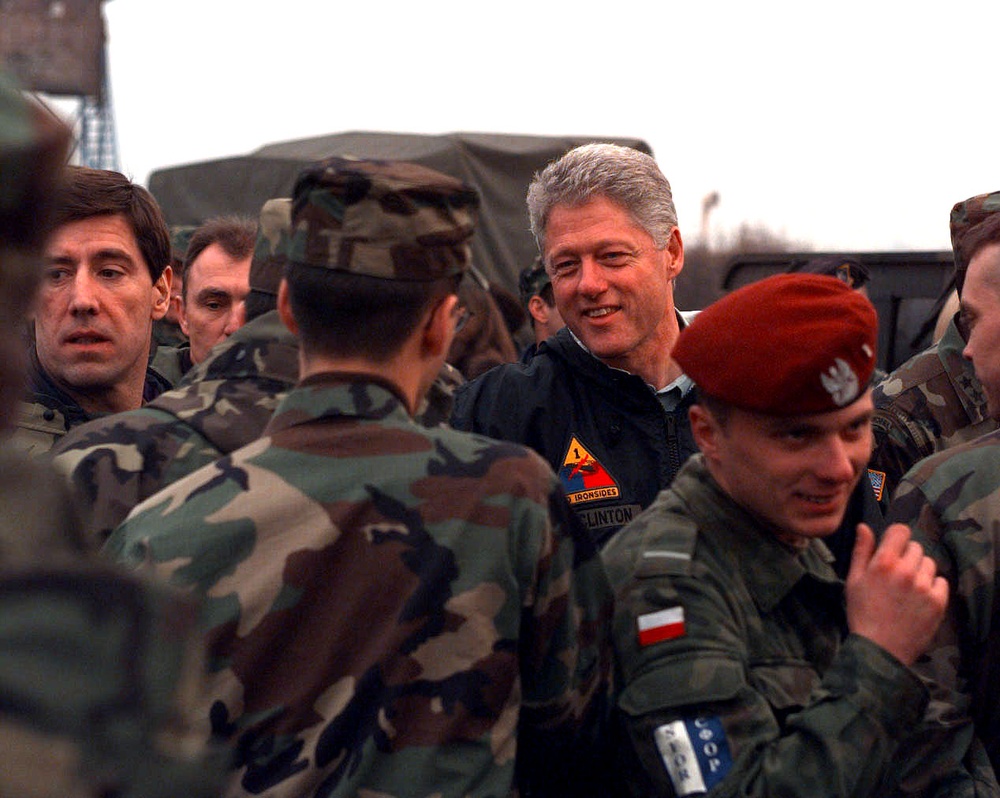 President Bill Clinton shakes hands with soldiers at the Tuzla Air Field.