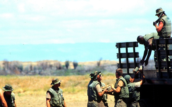 Marines unload deactivated land mines for destruction at Guantanamo Bay, Cuba.